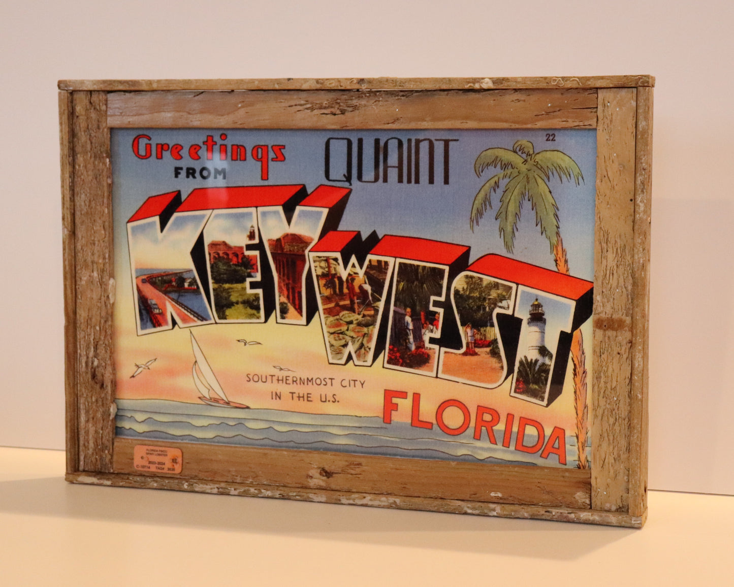 “Greetings from Quaint Key West, Florida” Postcard in Lobster Trap Frame